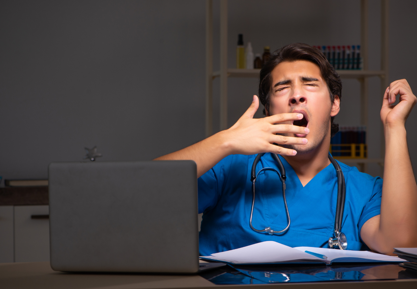 an image depicting a yawning doctor